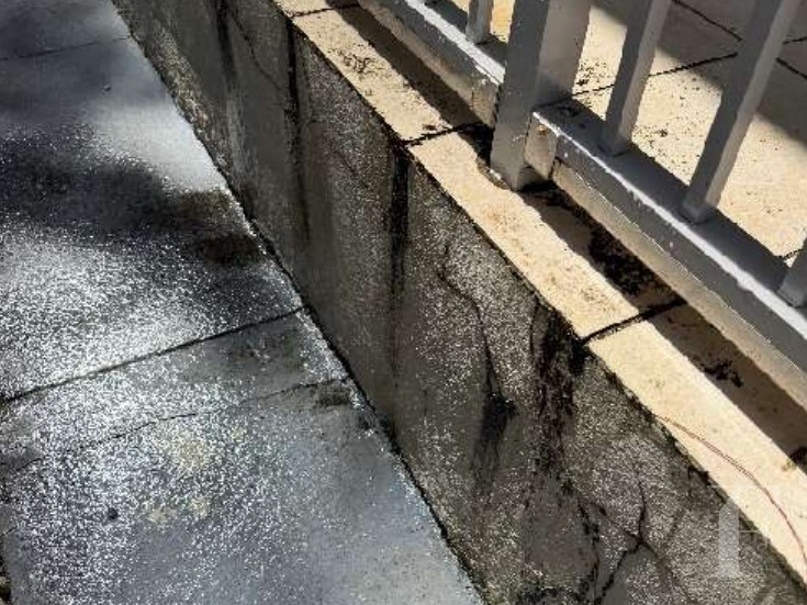 Staining below a leaking gutter