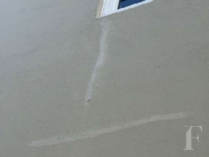 Earlier stucco crack repairs